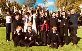 Worcester Stands Tall Students celebrating at New College Worcester at the arrival of George, the giraffe calf