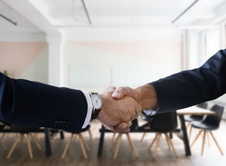 Two men doing a hand shake - Technology Talk