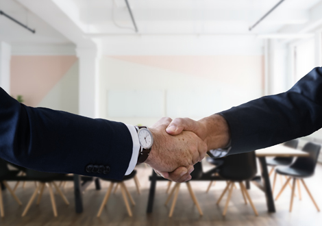 Men shaking hands - New business acquisition - Technology Talk
