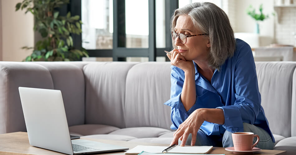 Lady sat at laptop on sofa - Don't be intimidated by digital