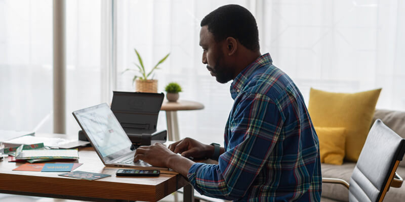 Man-at-desk-home-working Man-at-desk-home-working - Digital broking the star attraction