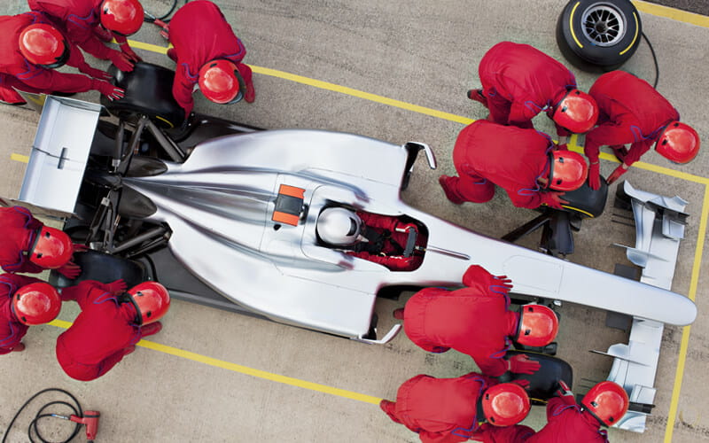 about-us-2 Racing car team changing tyres