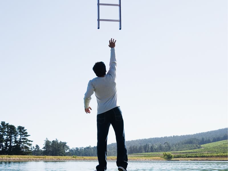 Man reaching for a ladder - websites