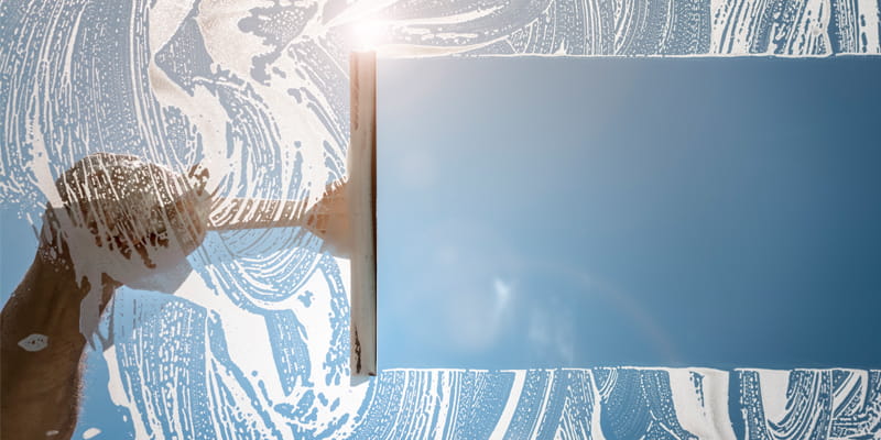 window-glass-enrichment-800-400 Arm cleaning window glass with squeegee